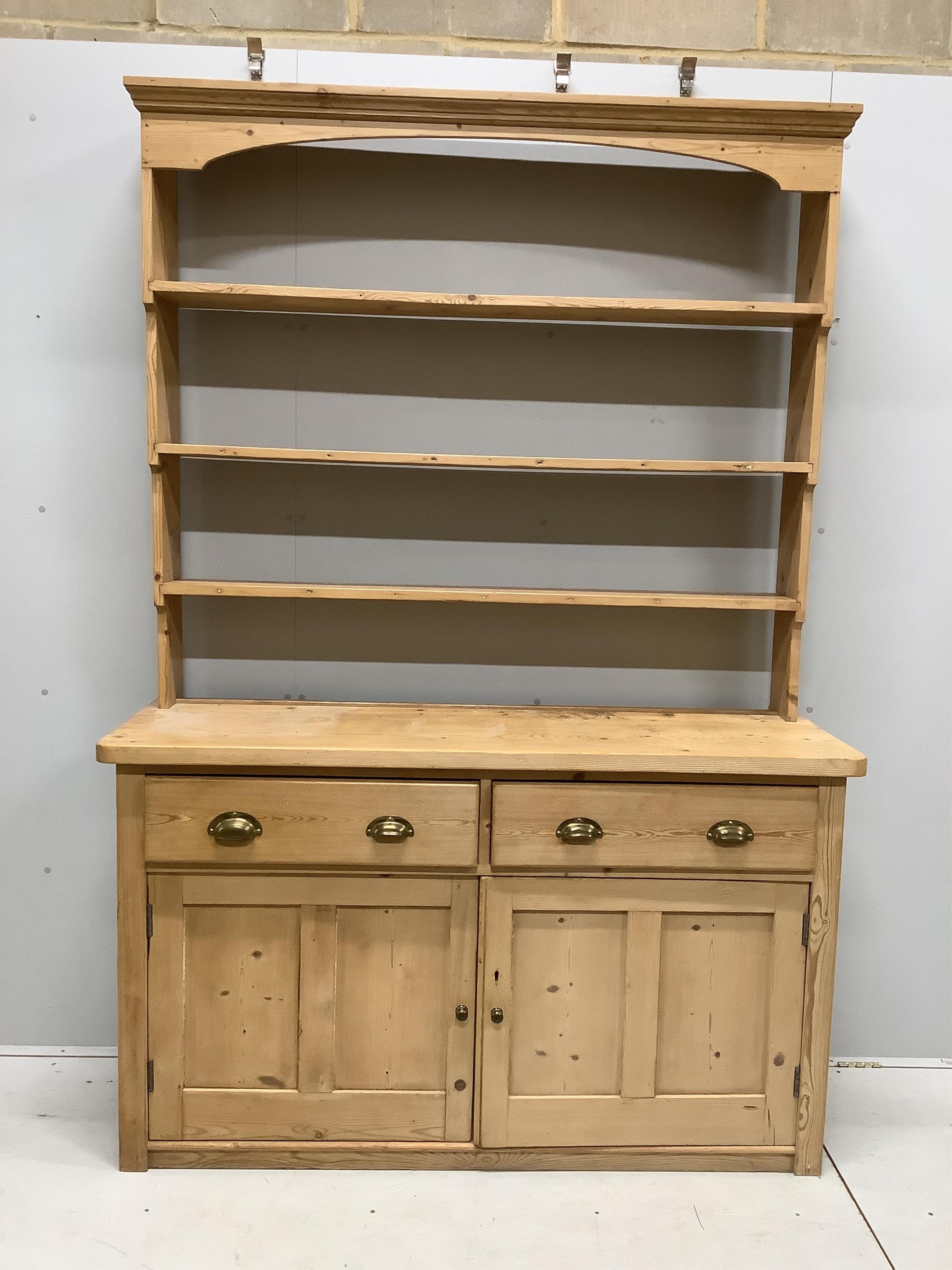 A Victorian pine dresser with open rack, width 152cm, depth 51cm, height 221cm. Condition - fair to good.